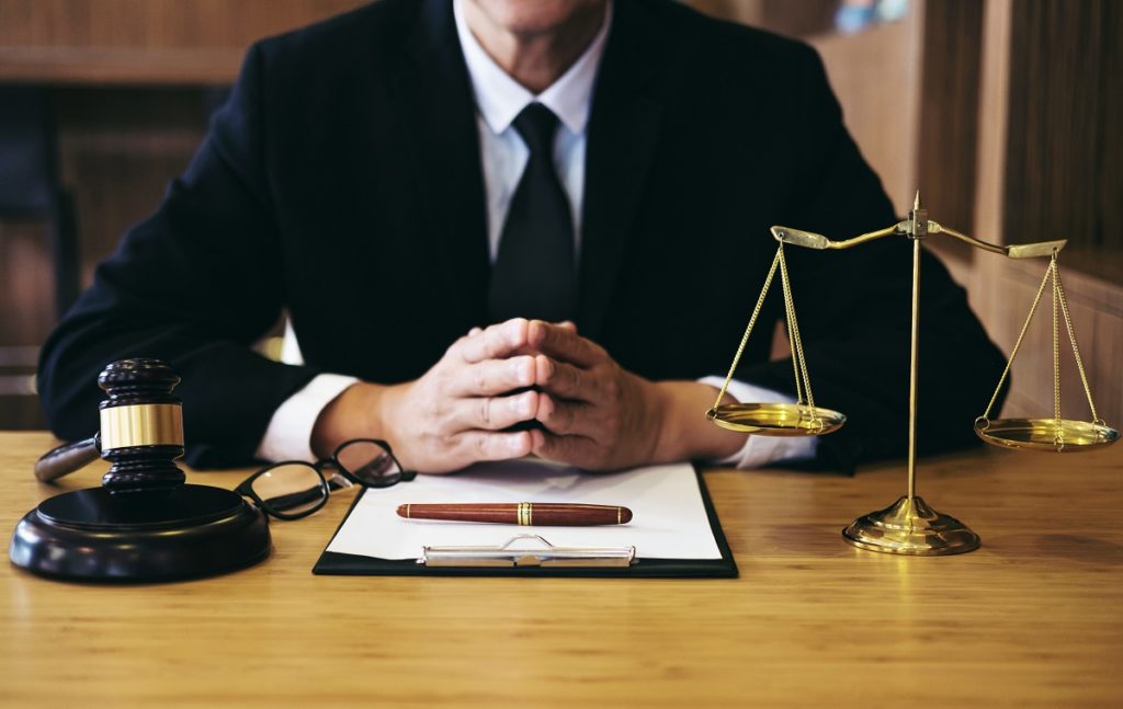 half shot of a lawyer on his desk