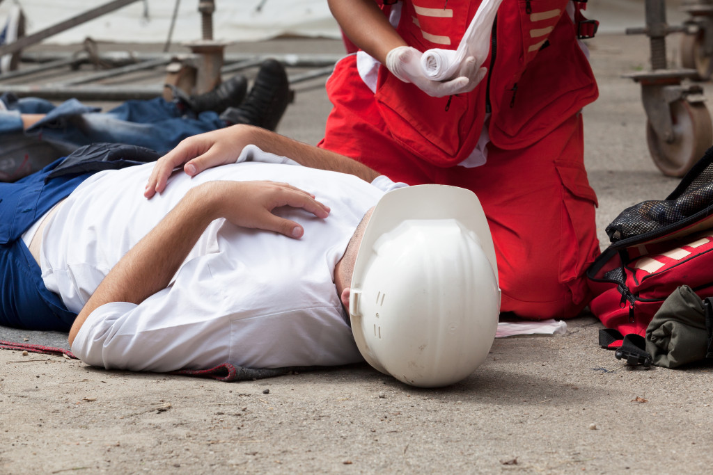 man laying on the ground injured