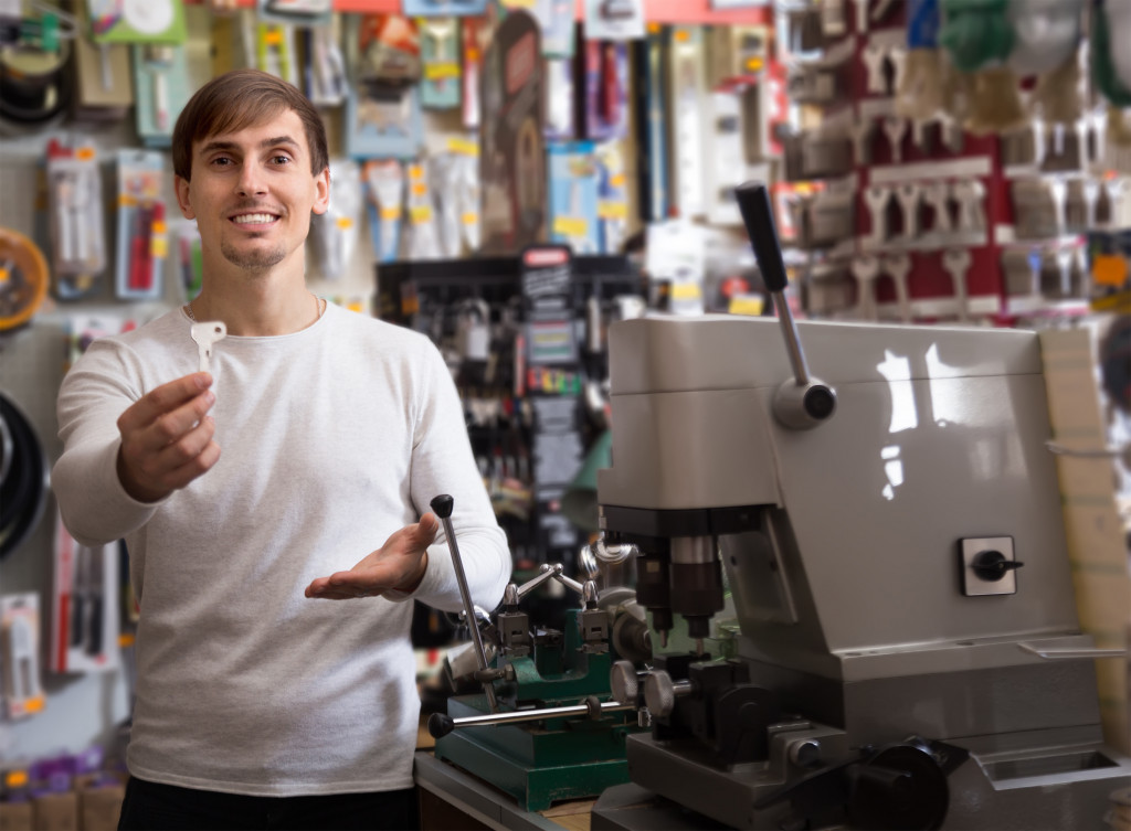 man holding out a pressed key