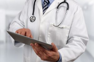 doctor holding a tablet