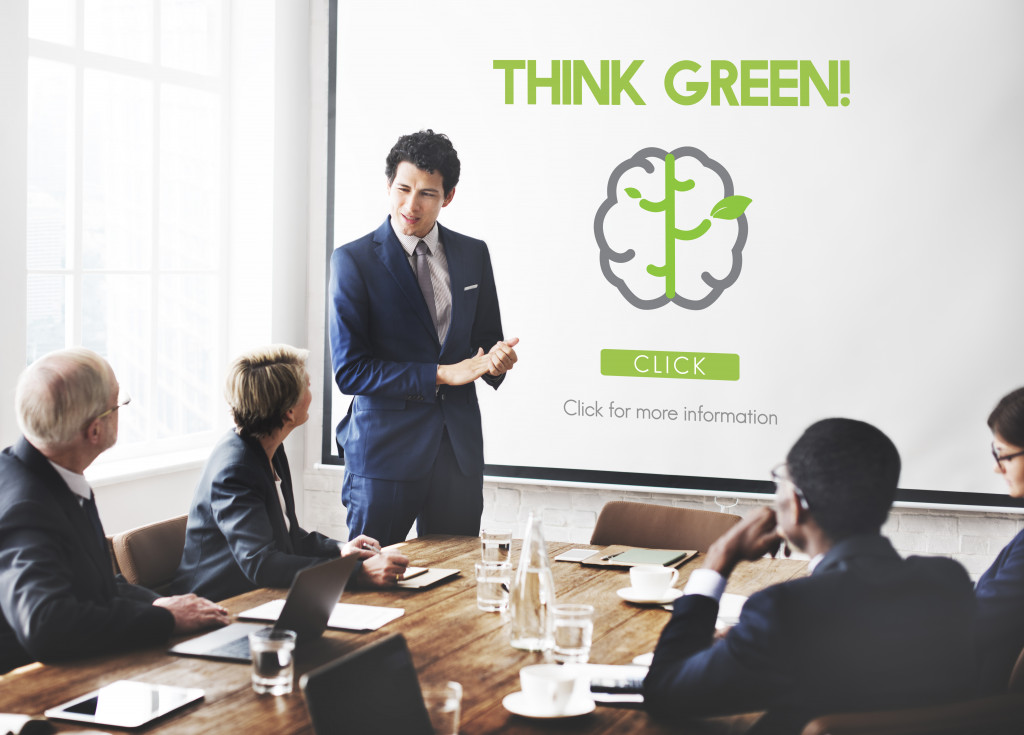 a businessman making a presentation about thinking green