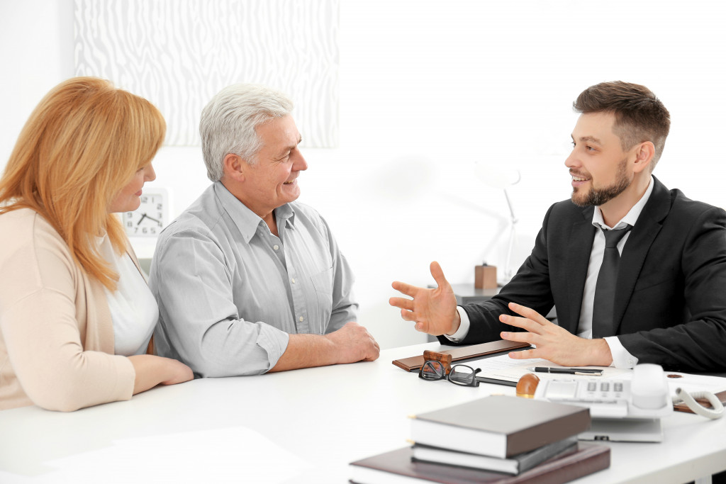 Elderly couple talking to lawyer