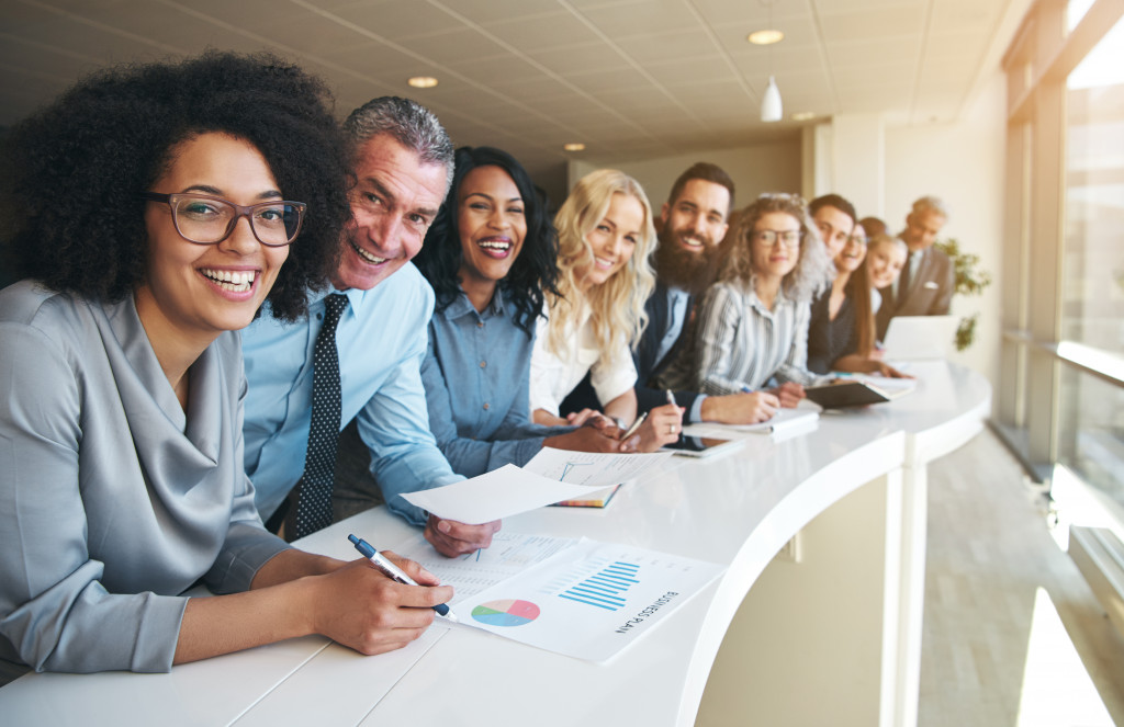 a line of happy and diverse employees