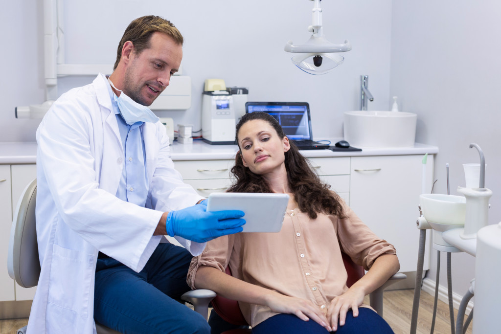 dentist and patient inside his clinic