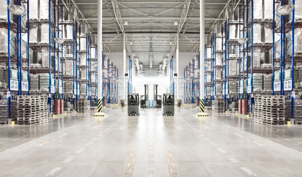 a huge warehouse lined with multiple shelves filled with boxes