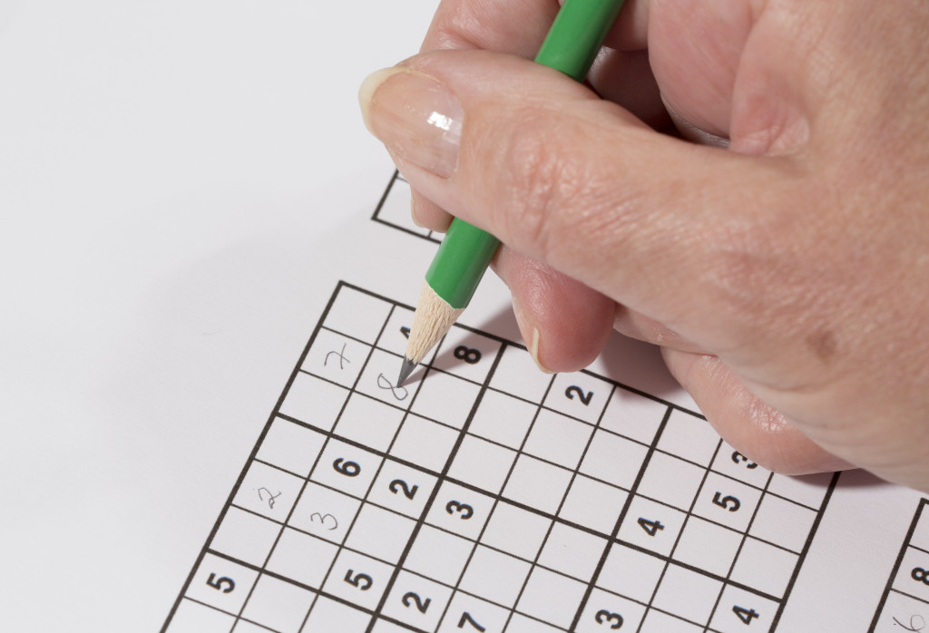 Business owner doing sudoku