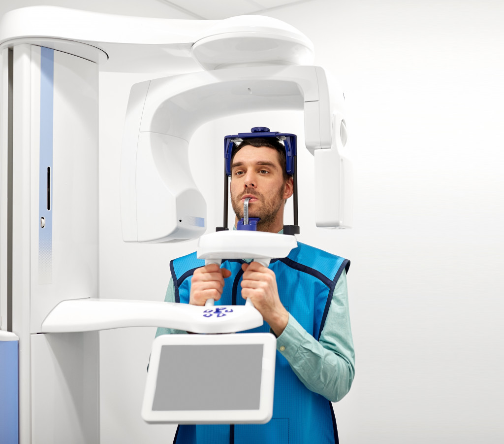 A panoramic x-ray being performed to a patient in a dental clinic