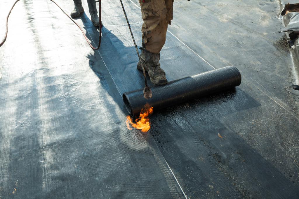 A man laying a waterproof system