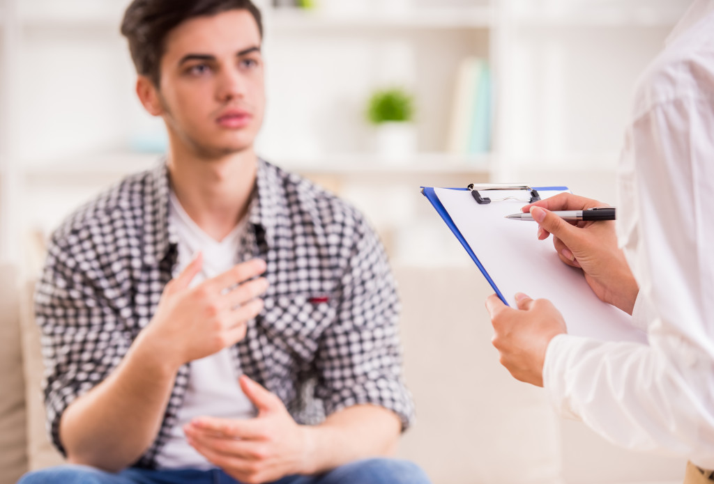 a man having a meeting with a therapist