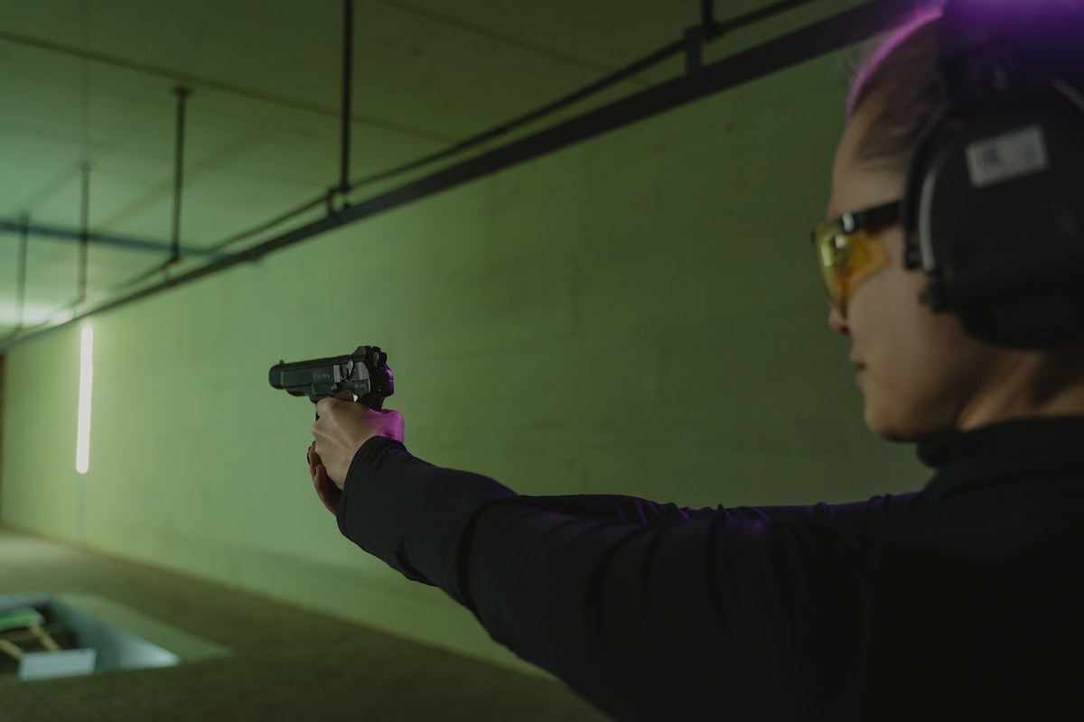 woman practicing range shooting