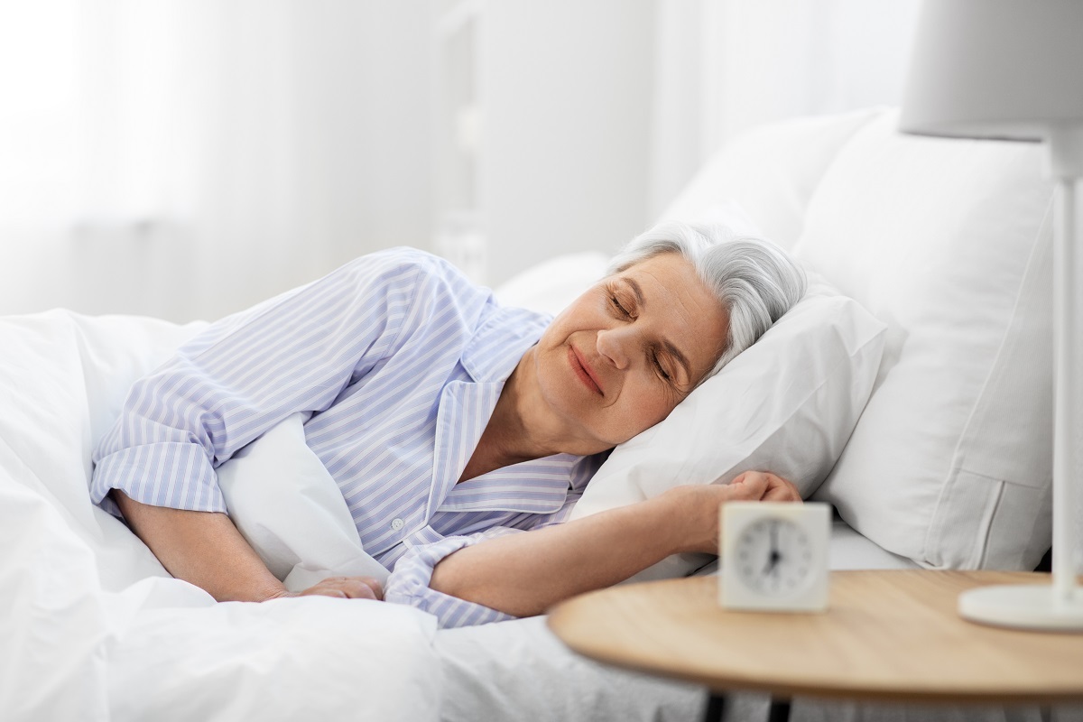 elderly woman sleeping in bed