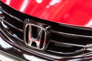 A Honda logo in a red car