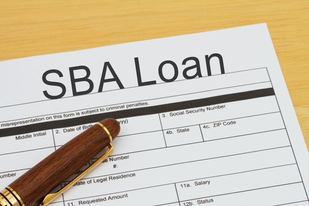 a pen on top of sba loan form